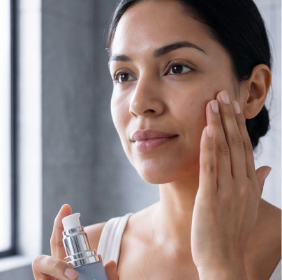 Applying peptide serum to face and neck with gentle circular motions