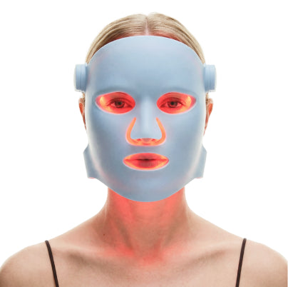 Wearing LED light therapy mask during treatment session for skin support