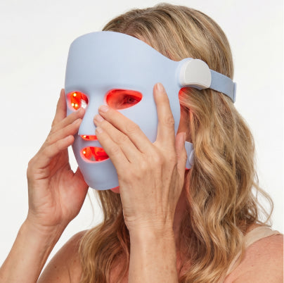 Following LED light therapy mask with peptide serum and cream as part of a skincare ritual